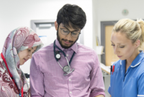 Three doctors talking together 