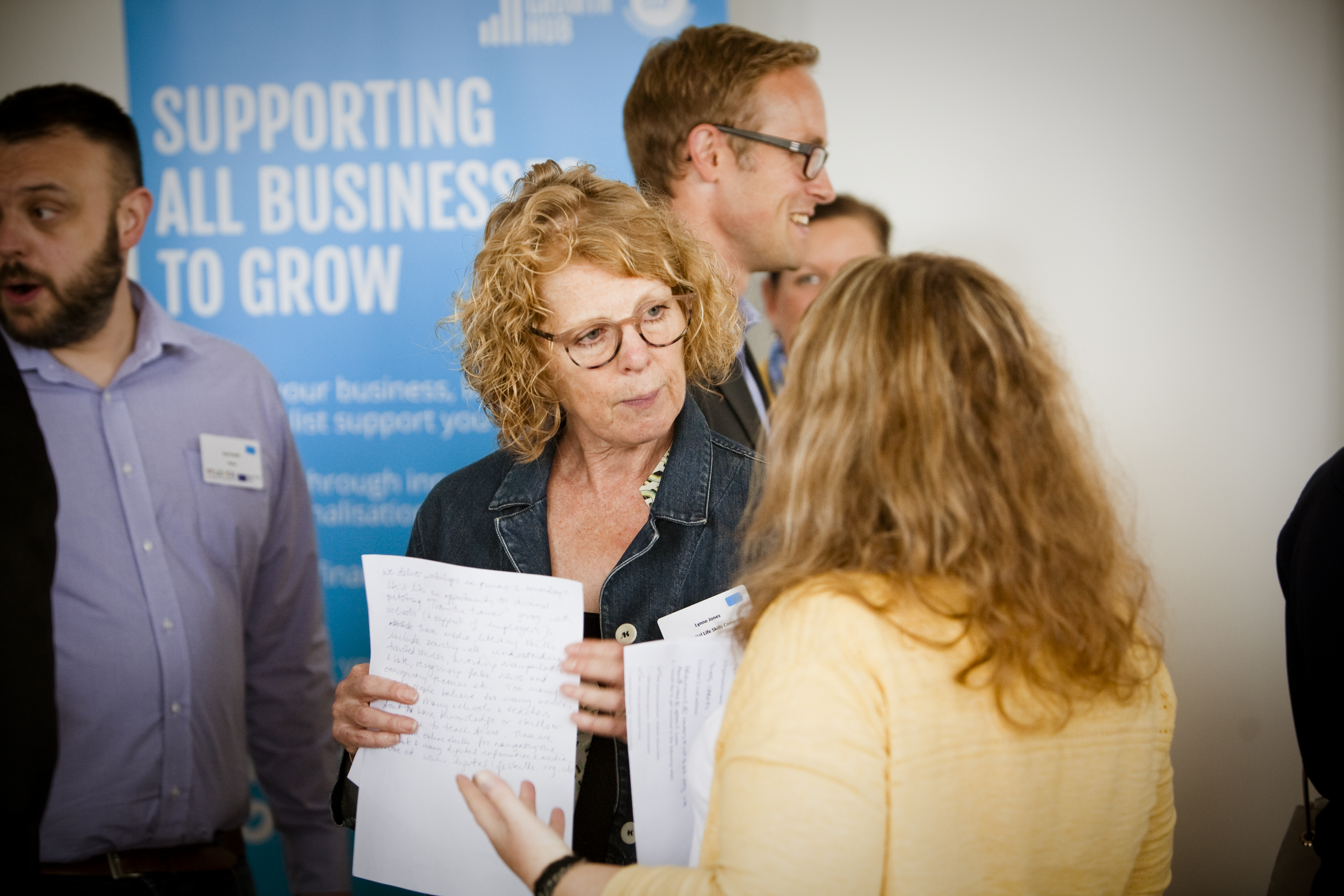 Attendees talking at an event