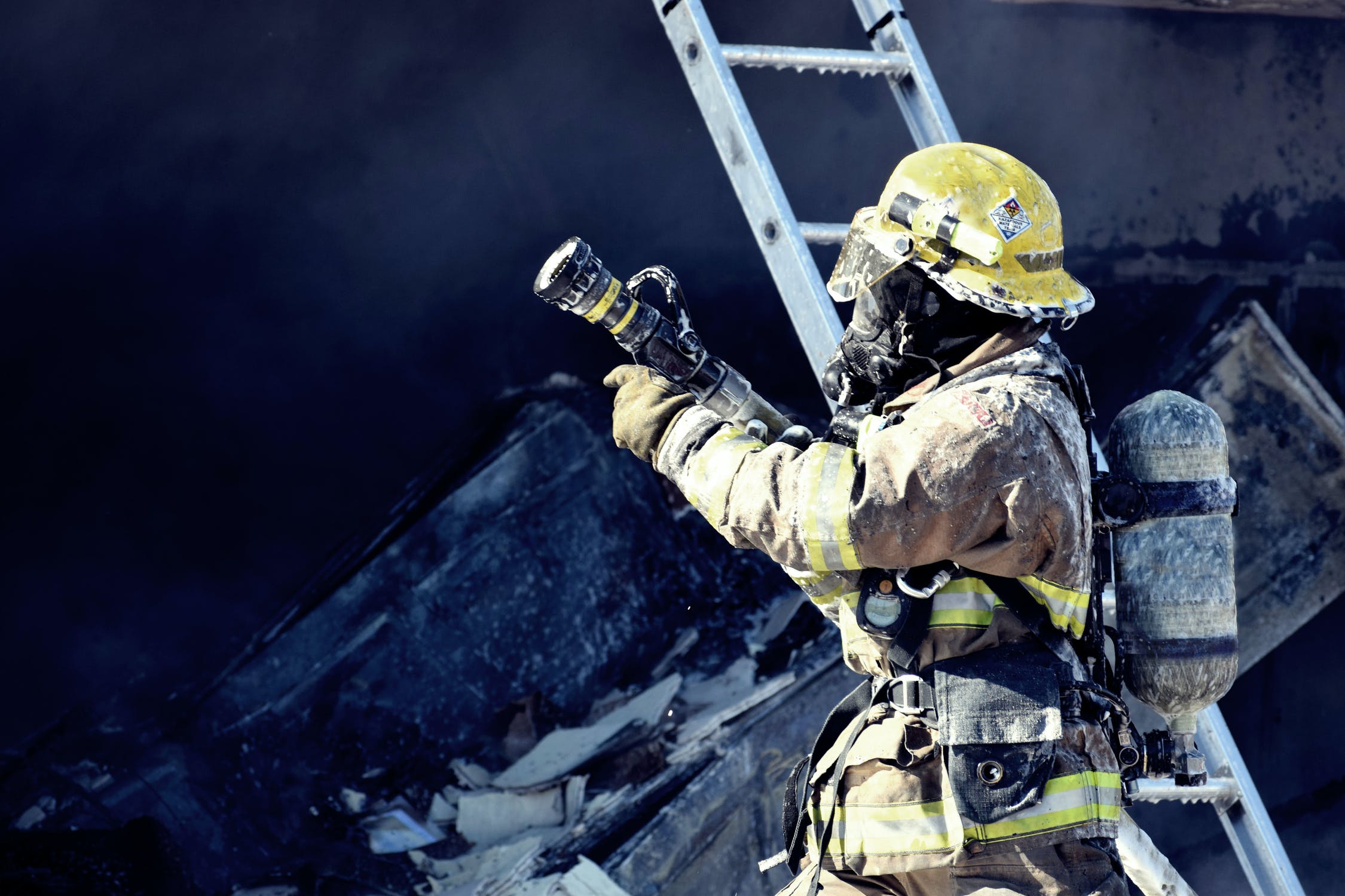 Firefighter at the scene of a burnt building 