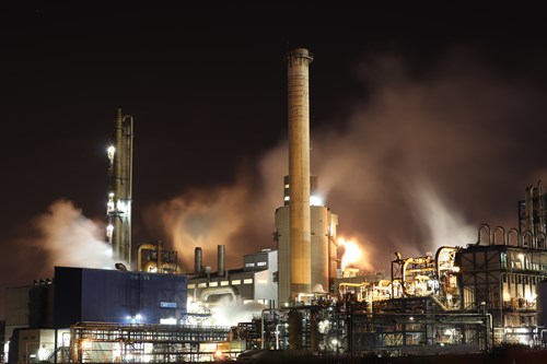 Chemical plant building at night 