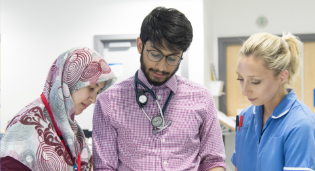 Three doctors talking together 