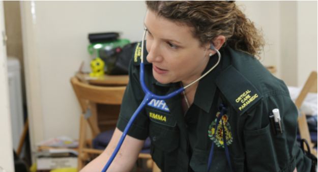 NHS Paramedic using a stephoscope 