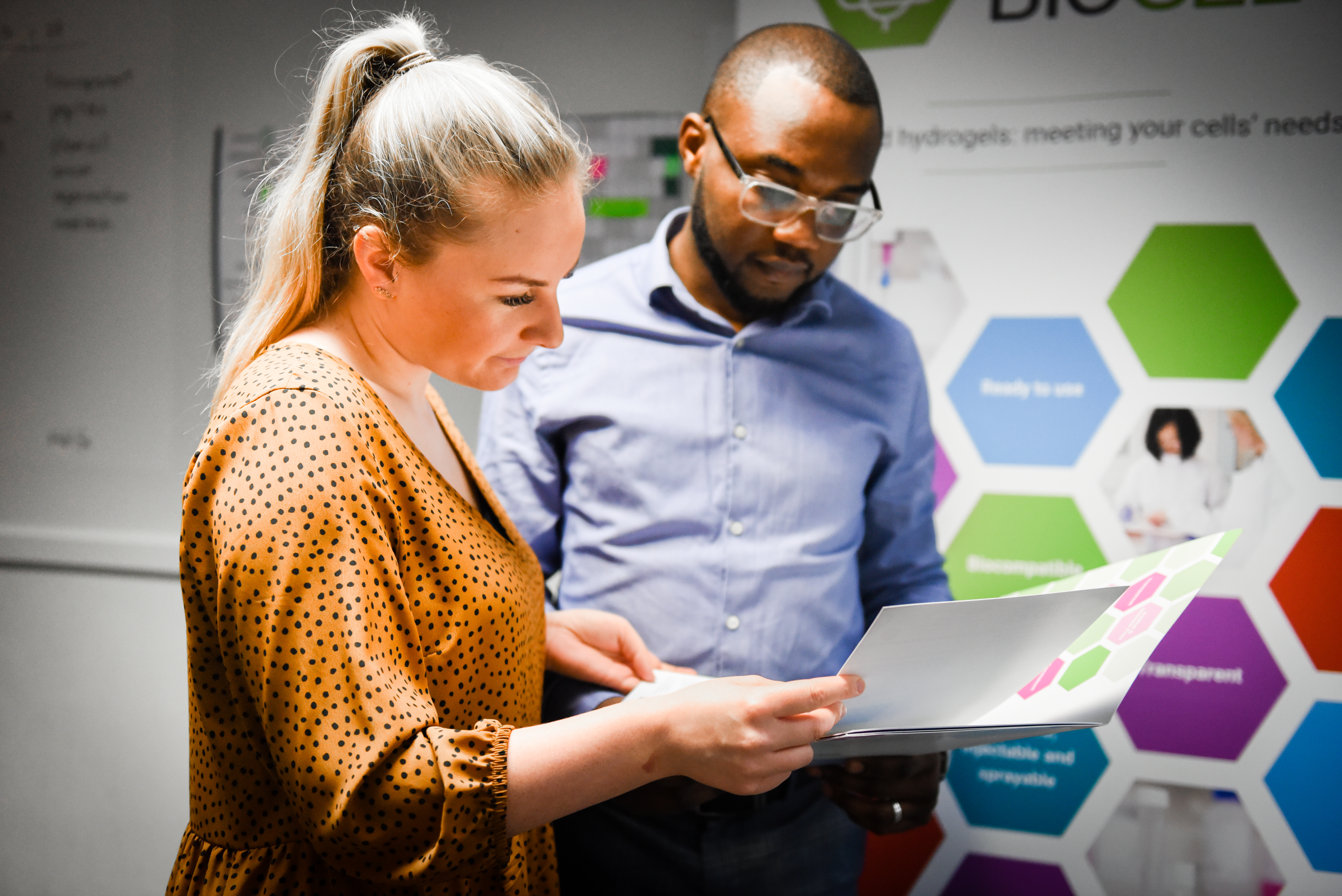 Man and woman reading a document